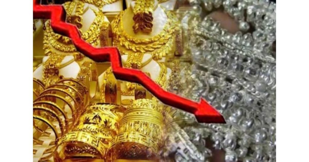 Gold and silver bars displayed in Indian bullion market showing slight price decline