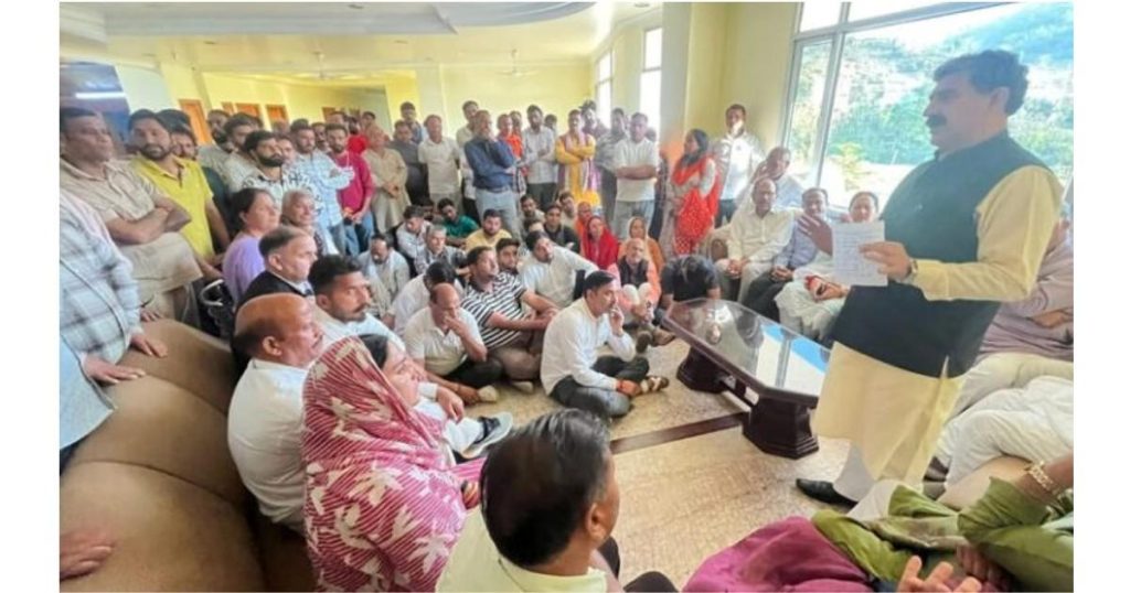 Protesters sitting near Shiv Khori shrine gate in Ransoo demanding extension of yatra timings